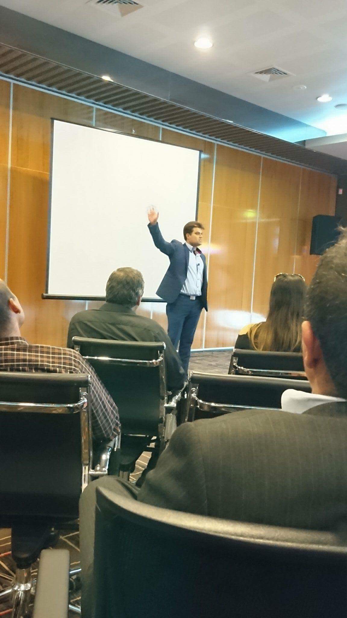 Ryan Gomez addressing a community audience