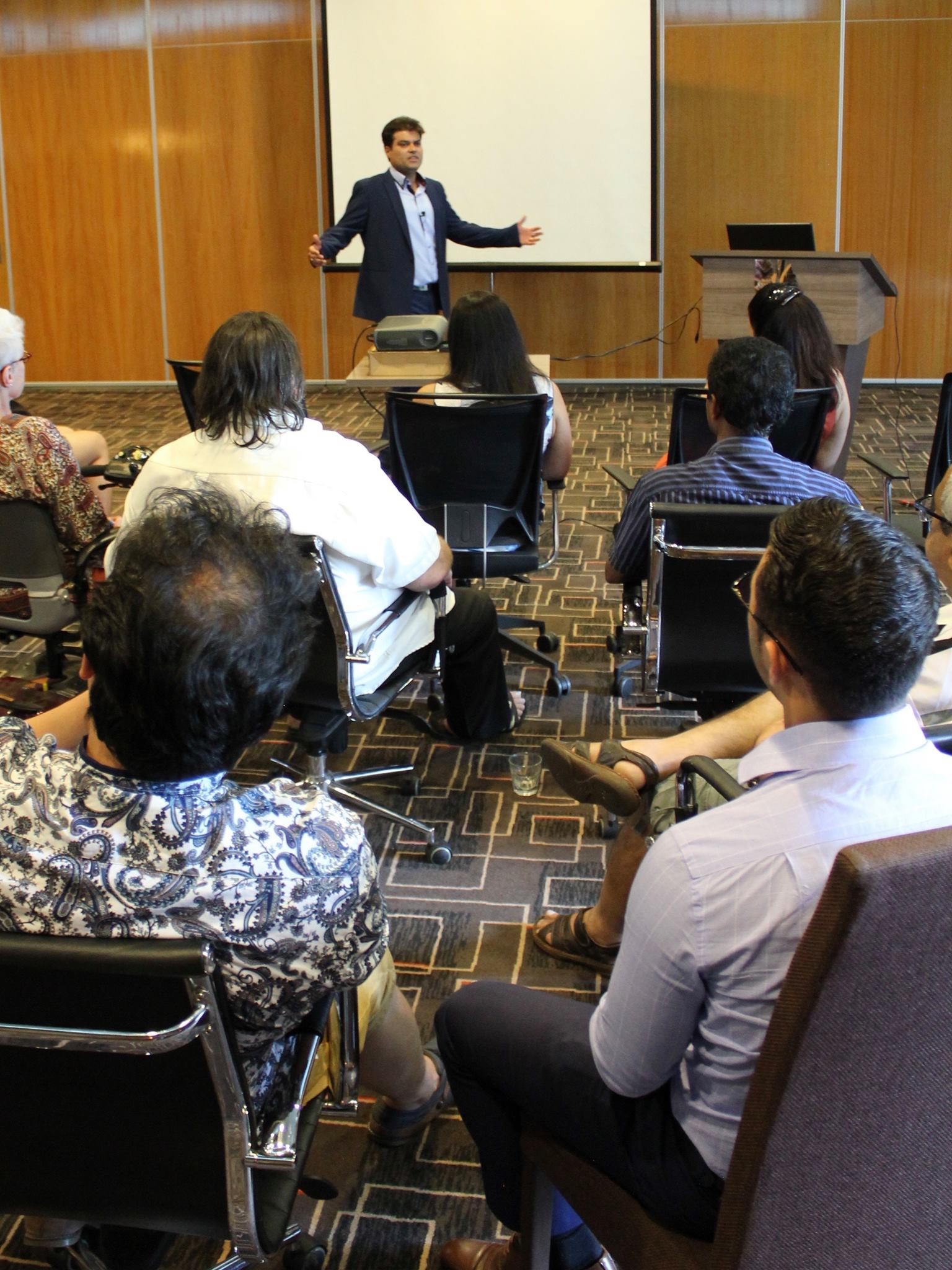 Ryan Gomez leading an intimate leadership workshop, connecting with audience members up close