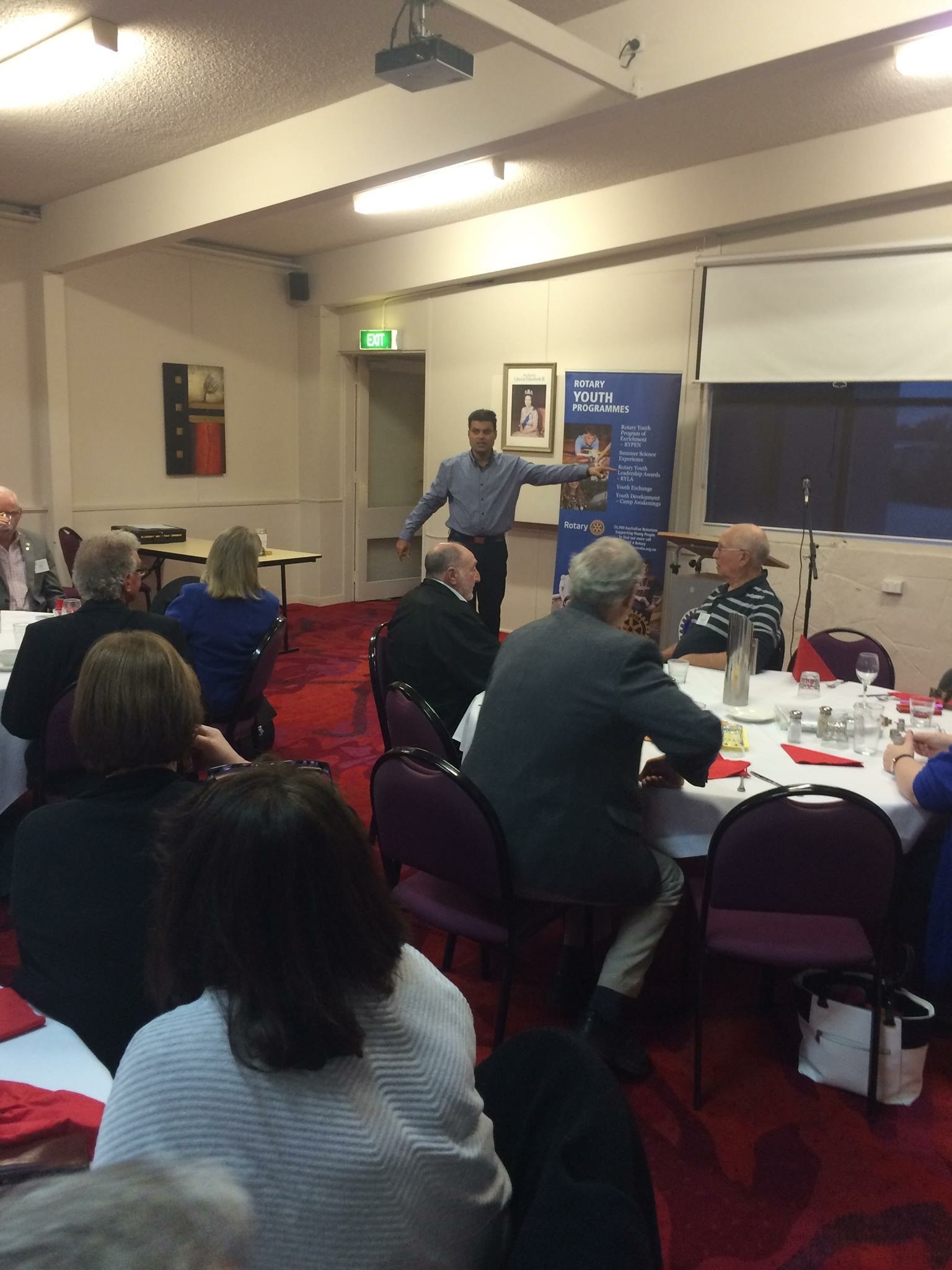 Ryan Gomez speaking at a Rotary Youth Programme dinner event
